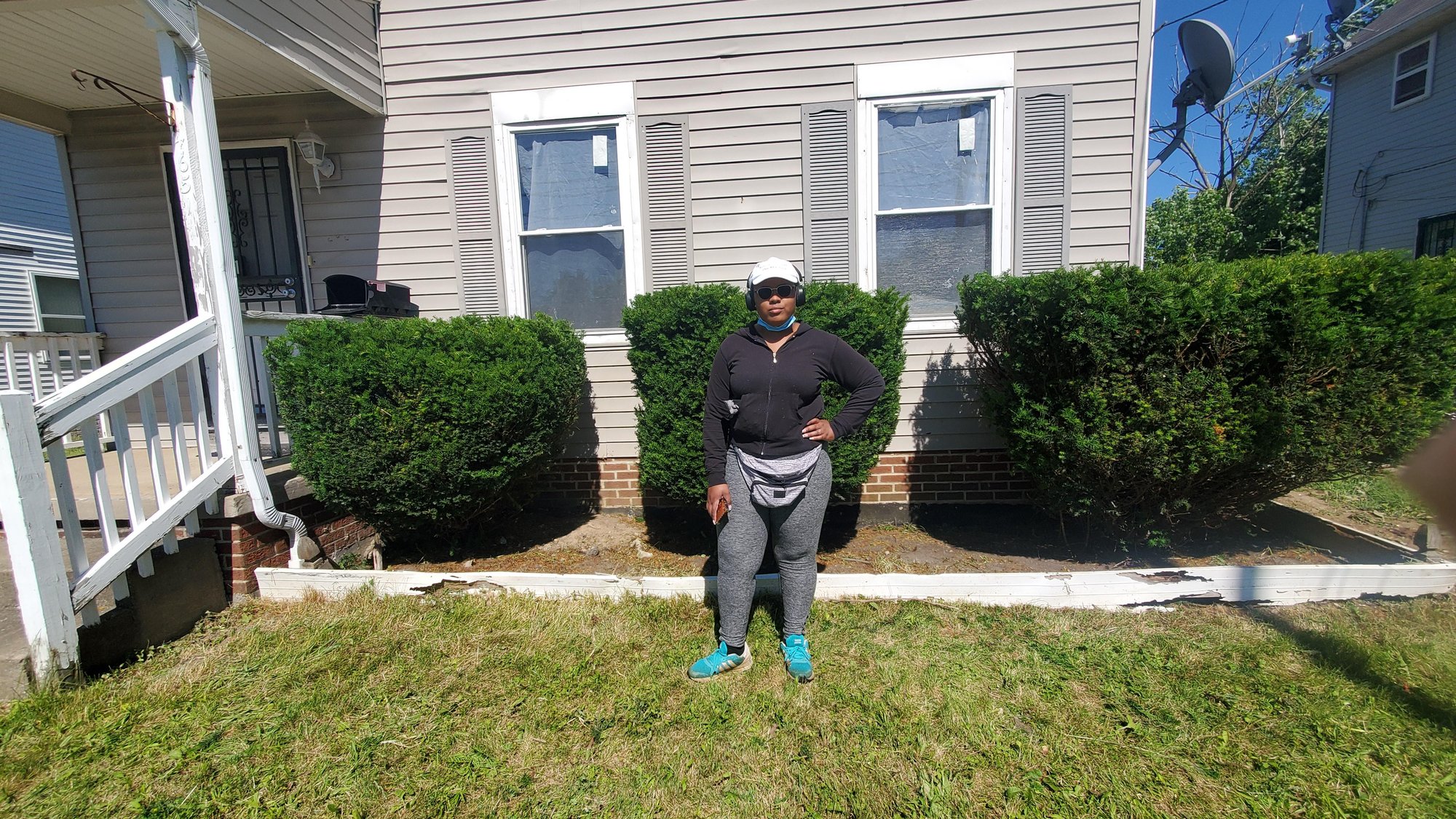 Bed maintenance via shrub trimming in Euclid, Oh by an female employee at Kevin J Services