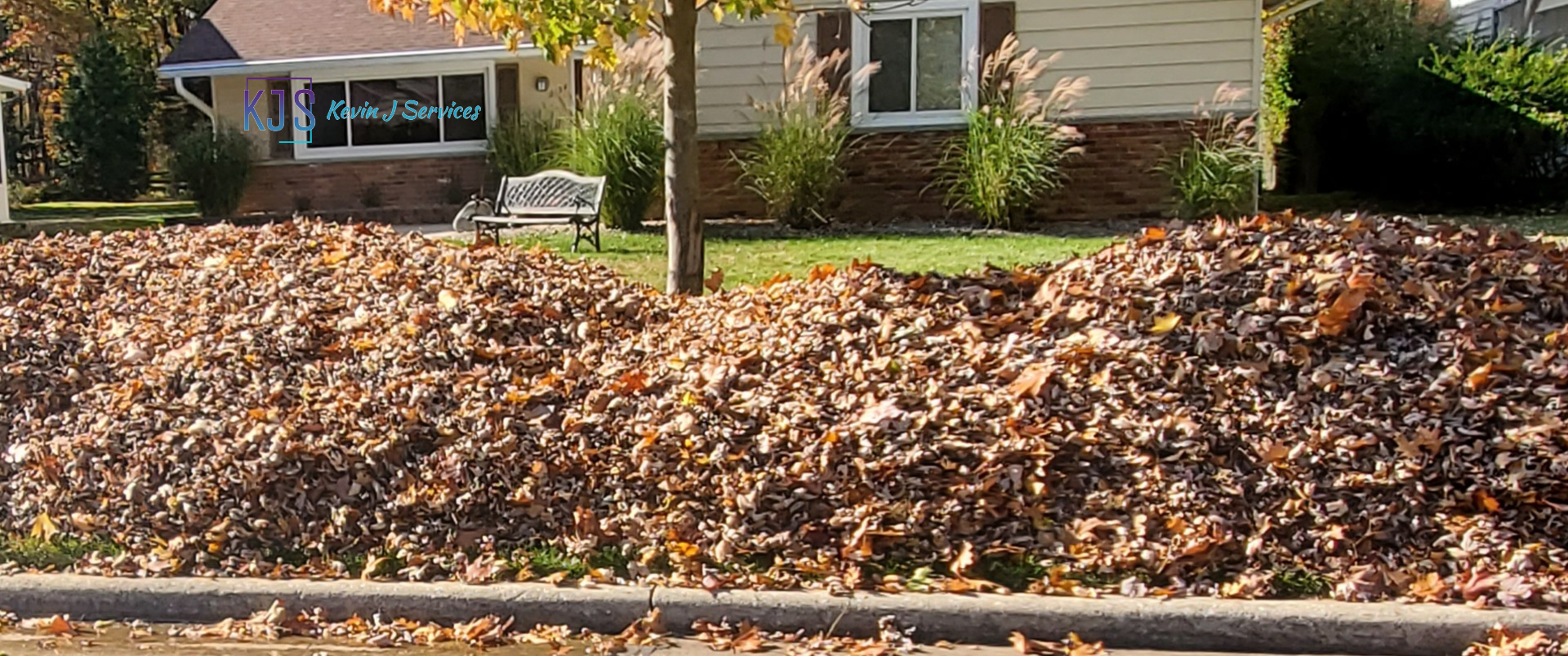 Front yard with leaves blew to curb for city pickup on Brandywine Dr, in Euclid OH by Kevin J Services