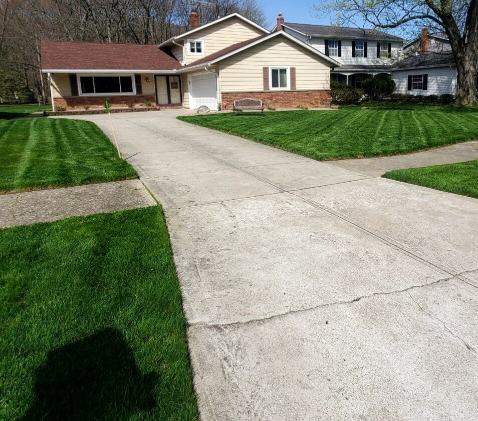 Front lawn of a property in Euclid, OH after a lawnmowing service by Kevin J Services