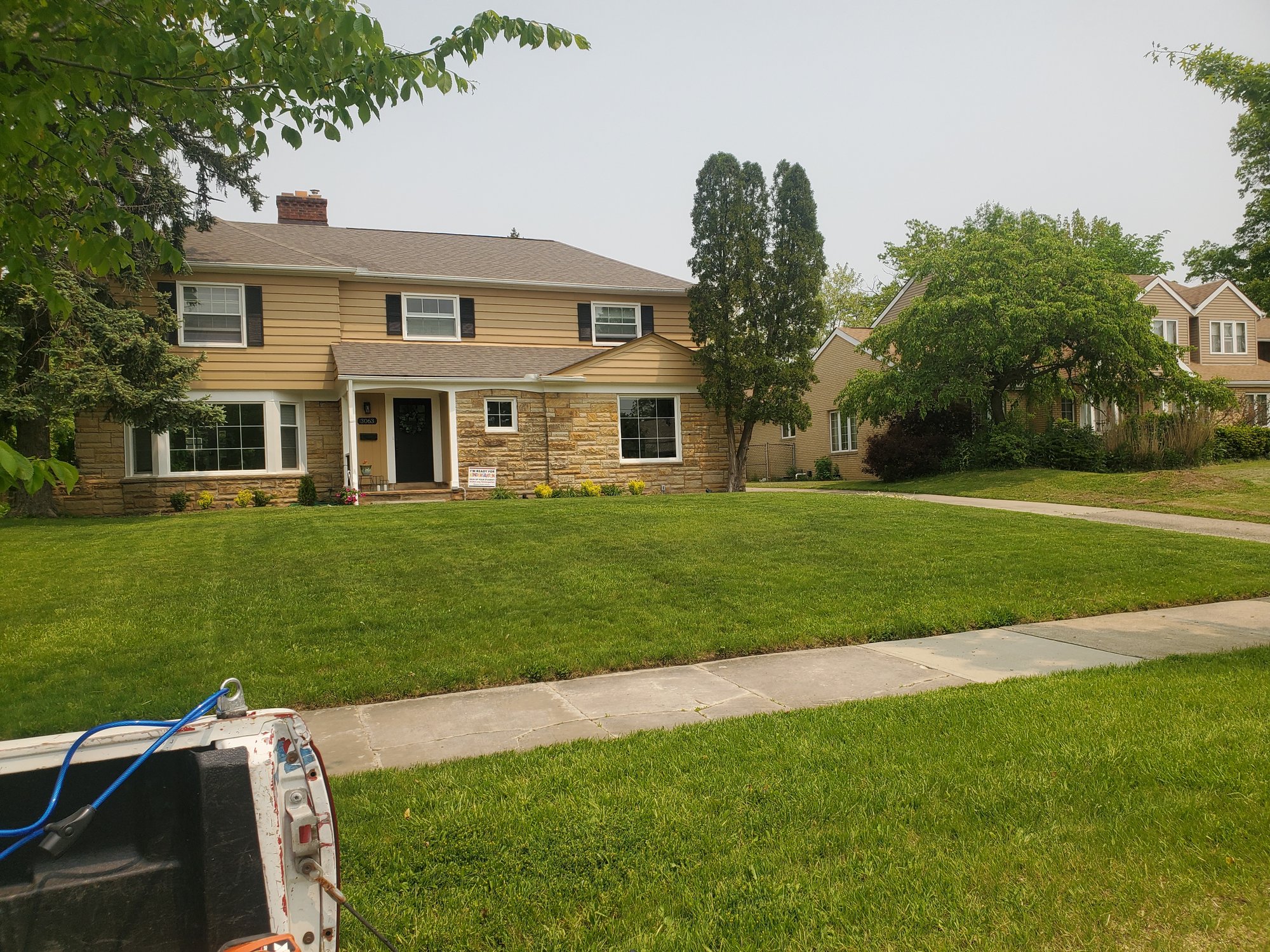 Northeast Ohio green front yard after a lawn mowing service from Kevin J Services