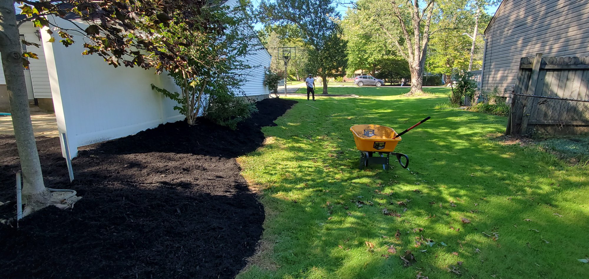 mulch being spread backyard in Northeast Ohio by Kevin J Services.